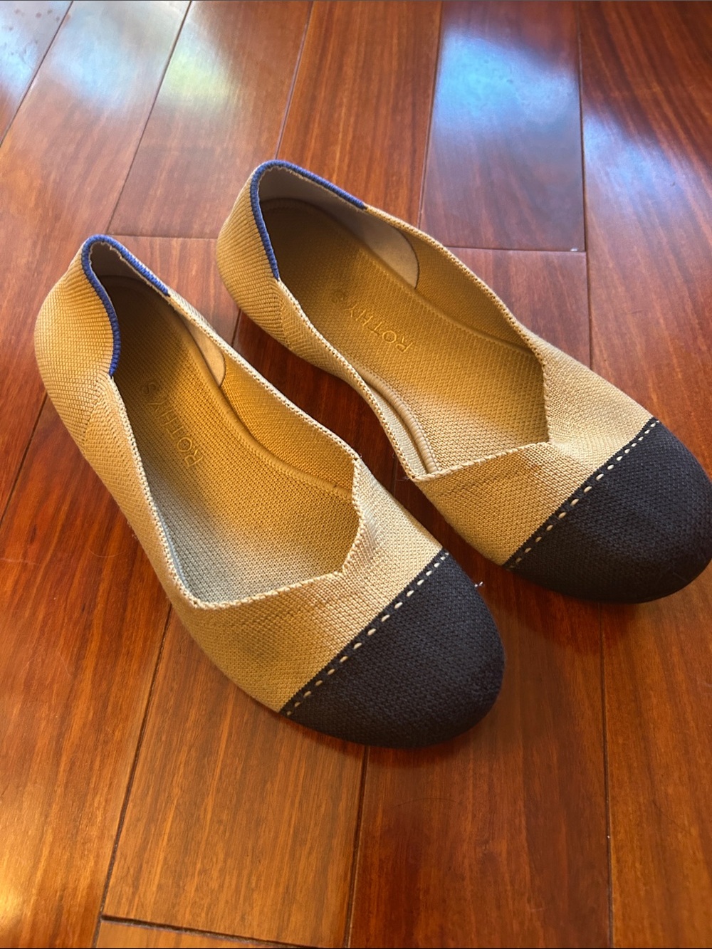 Rothy's Beige Flats with Black Cap Toe